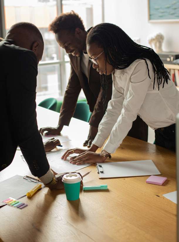 NIBCA team members collaborating on community outreach planning